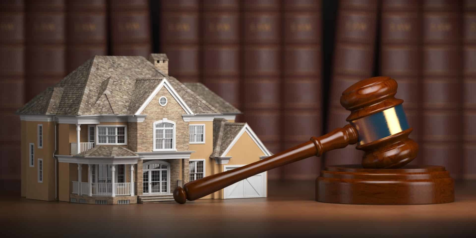 house-with-gavel-and-law-books-real-estate-law-XM3QZCA-Large