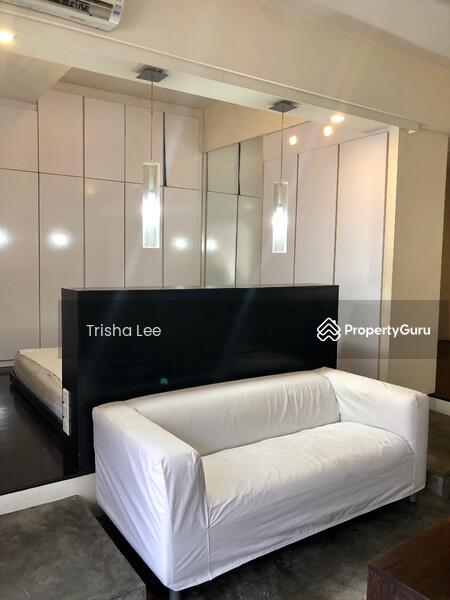 Living Area with King size bed behind the sofa