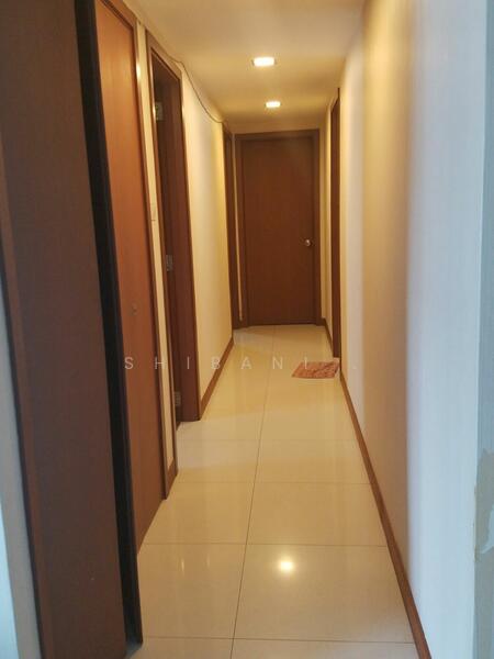 Corridor to the rooms with storage on the left