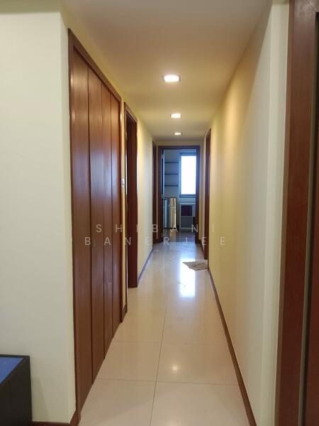 Corridor to the rooms with storage on the left