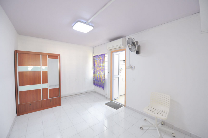 Master Bedroom furnished with bed, study table. Wall fan and air conditioner.