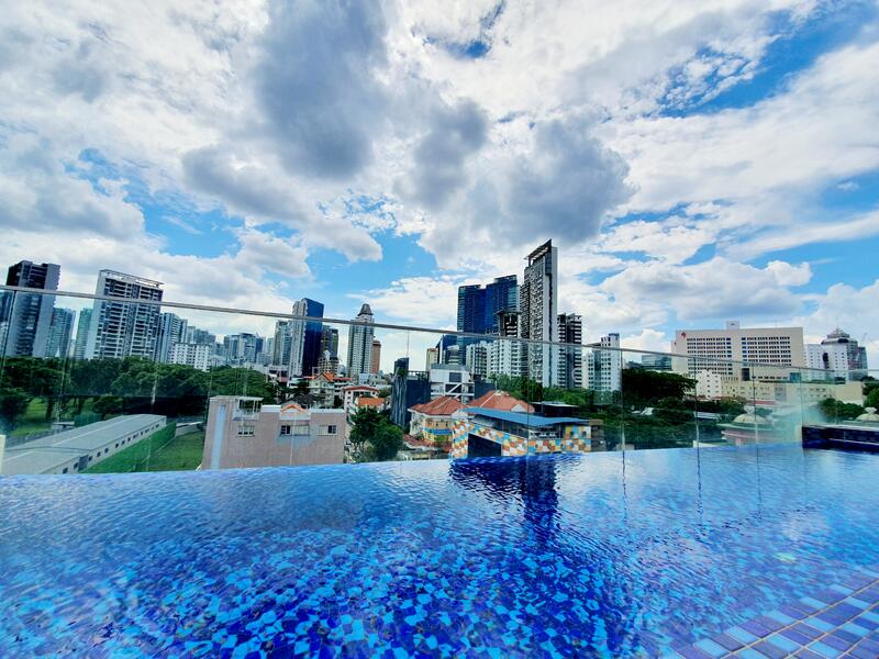 Rooftop Swimming Pool Overseeing The City Skyline