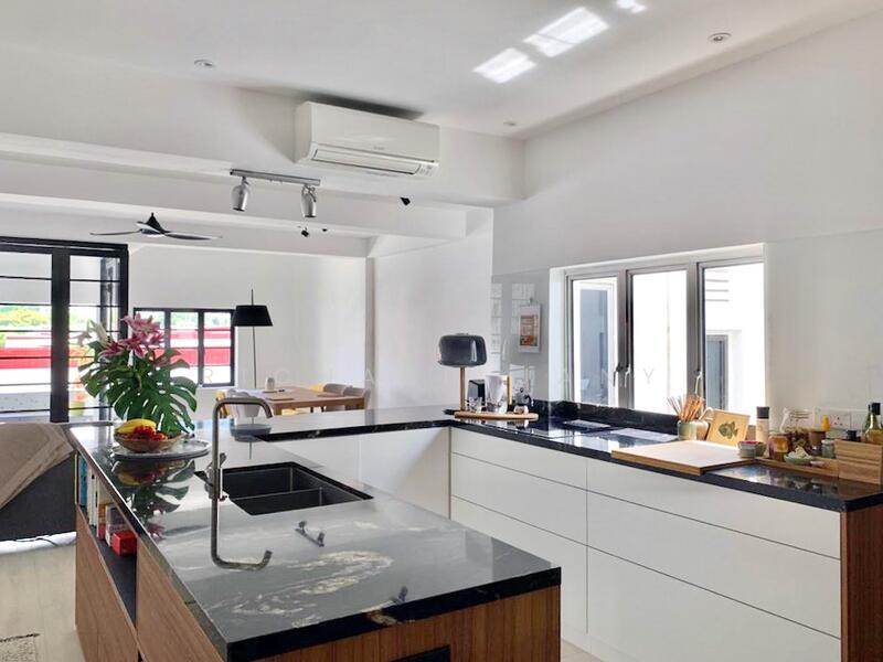 Rare! A brightly lit kitchen interacts with living room