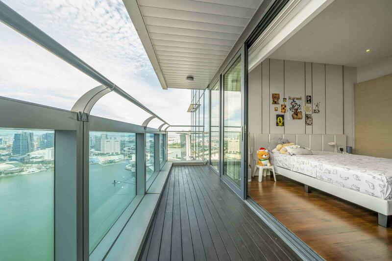 bedroom 3 w attached balcony and city and bay view