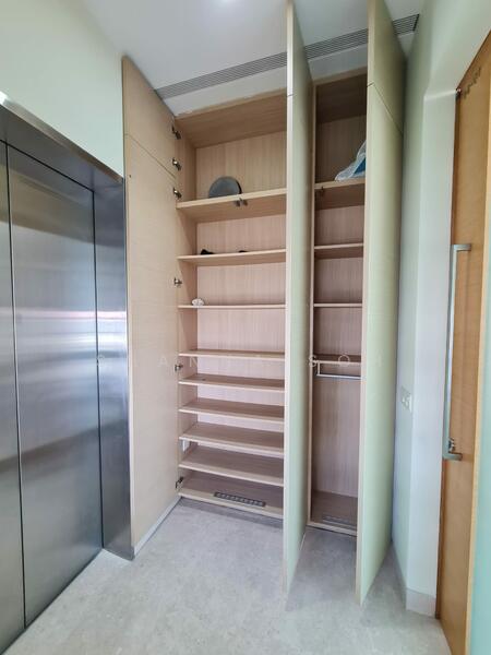 Private lift lobby with shoes and storage cabinet