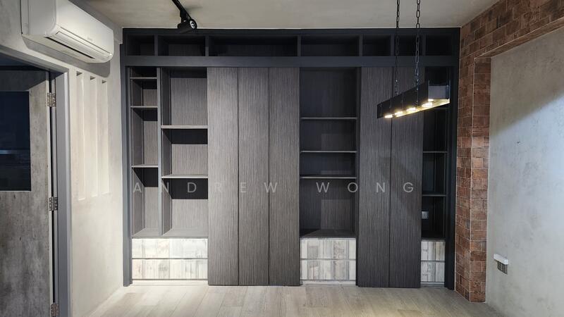 Private master bedroom hidden behind a shelving unit