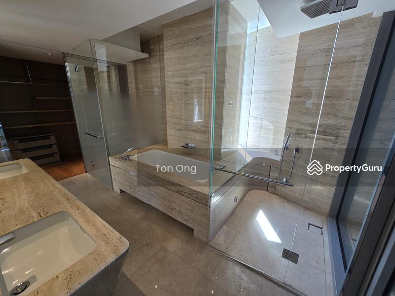 Bath tub, rain shower and his/hers wash basin of master bath