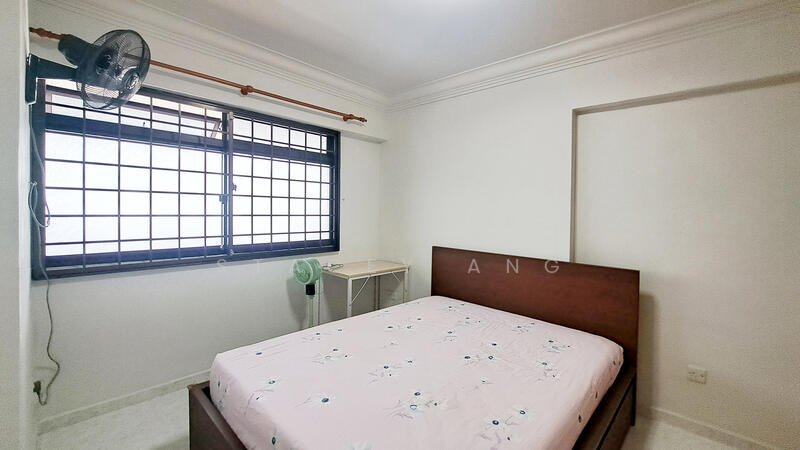 Very clean bedroom with queen-size bed, aircon, table and fans.