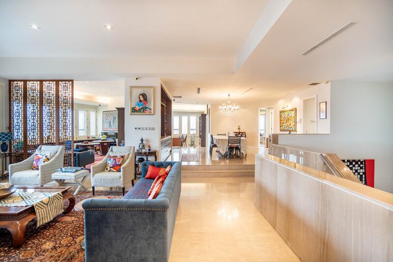 Grand living hall with house-like proportions and custom library wall