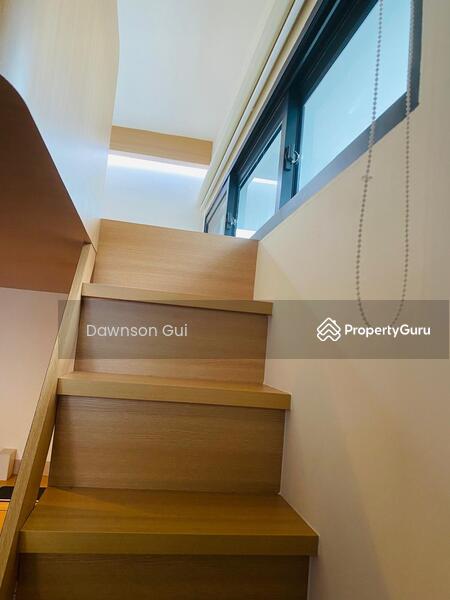 Stairs leading to bed on top of loft
