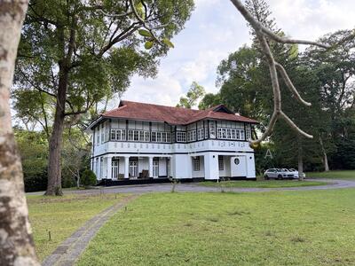 For Rent - Black & White Bungalow with Lush Greenery