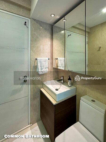 Common Bathroom features marble walls, custom cabinetry and designer fittings
