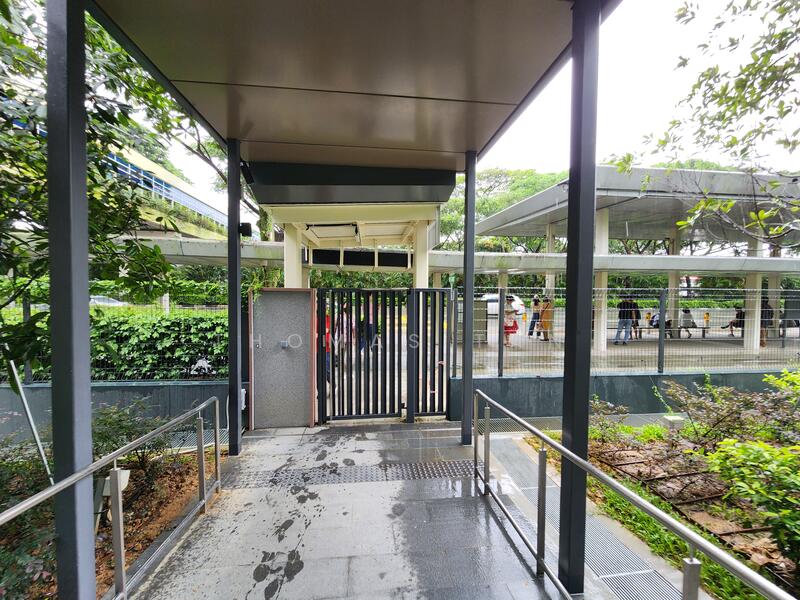 Sheltered to side gate bus stop outside