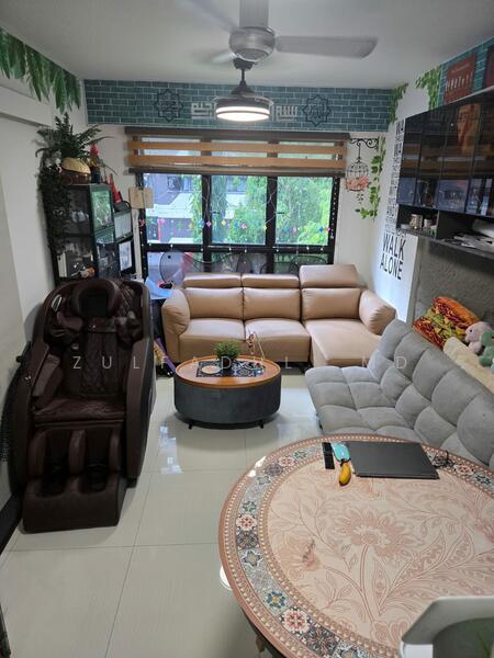 Living room facing lush greenery with no built-ins