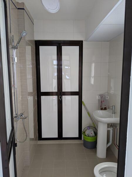 Toilet accessible from both kitchen and bedroom. 