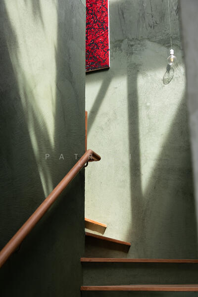 A staircase in the living room leads to the Master suite and private garden on the upper floor.