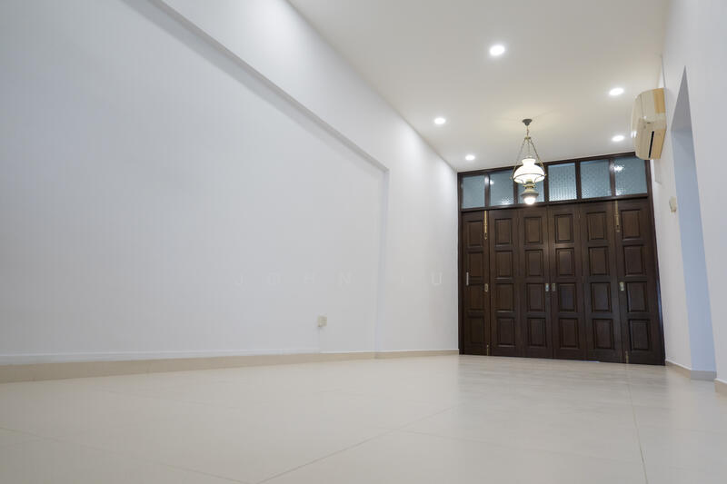 Living room w wooden doors to kitchen