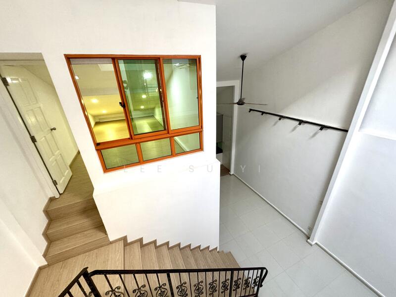 Staircase into double volume dining 